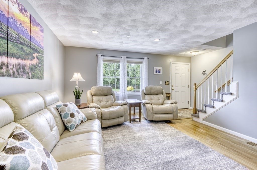 159 Allen Road, Unit 24 Billerica, MA 01821 - Photo 8 of 34 a living room with furniture and a large window