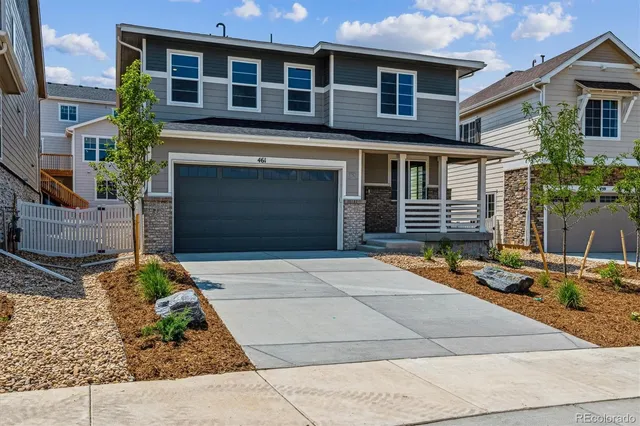 a front view of a house with garage
