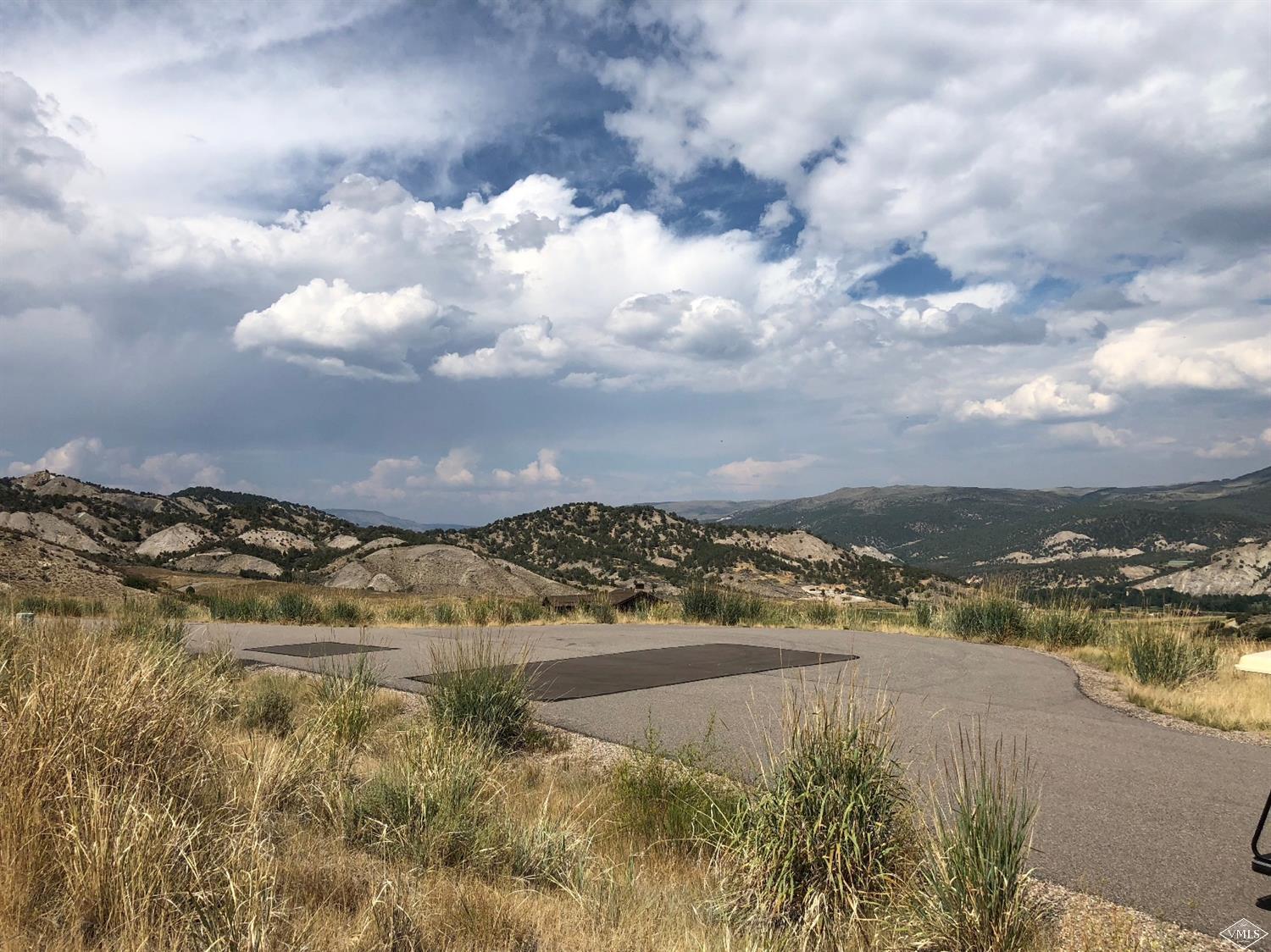 283 Squires Lane Eagle, CO 81631 - Photo 15 of 17 a view of a lake with houses in the back