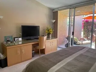 a living room with a flat screen tv and a fireplace