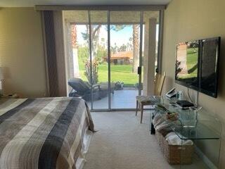 73446 Dalea Lane Palm Desert, CA 92260 - Photo 14 of 17 a bed sitting in a bedroom next to a window