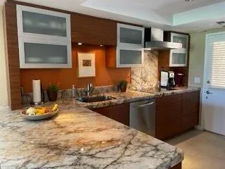 a kitchen with a sink and cabinets