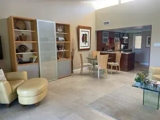 a living room with furniture and a table
