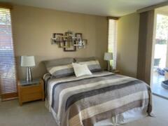 73446 Dalea Lane Palm Desert, CA 92260 - Photo 2 of 17 a bedroom with a bed and a window