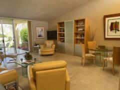 73446 Dalea Lane Palm Desert, CA 92260 - Photo 9 of 17 a living room with furniture and a flat screen tv