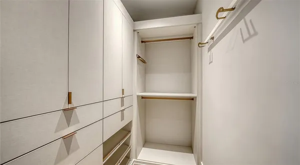 a view of storage and utility room with washer and dryer