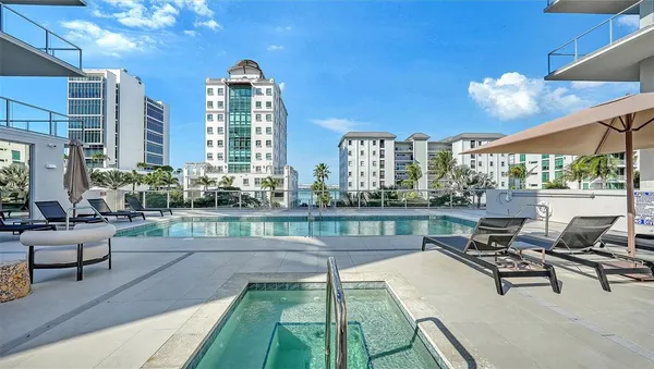 a view of a swimming pool with a patio