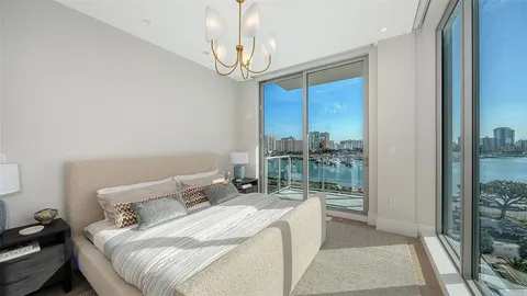 a bed room with a bed and a window