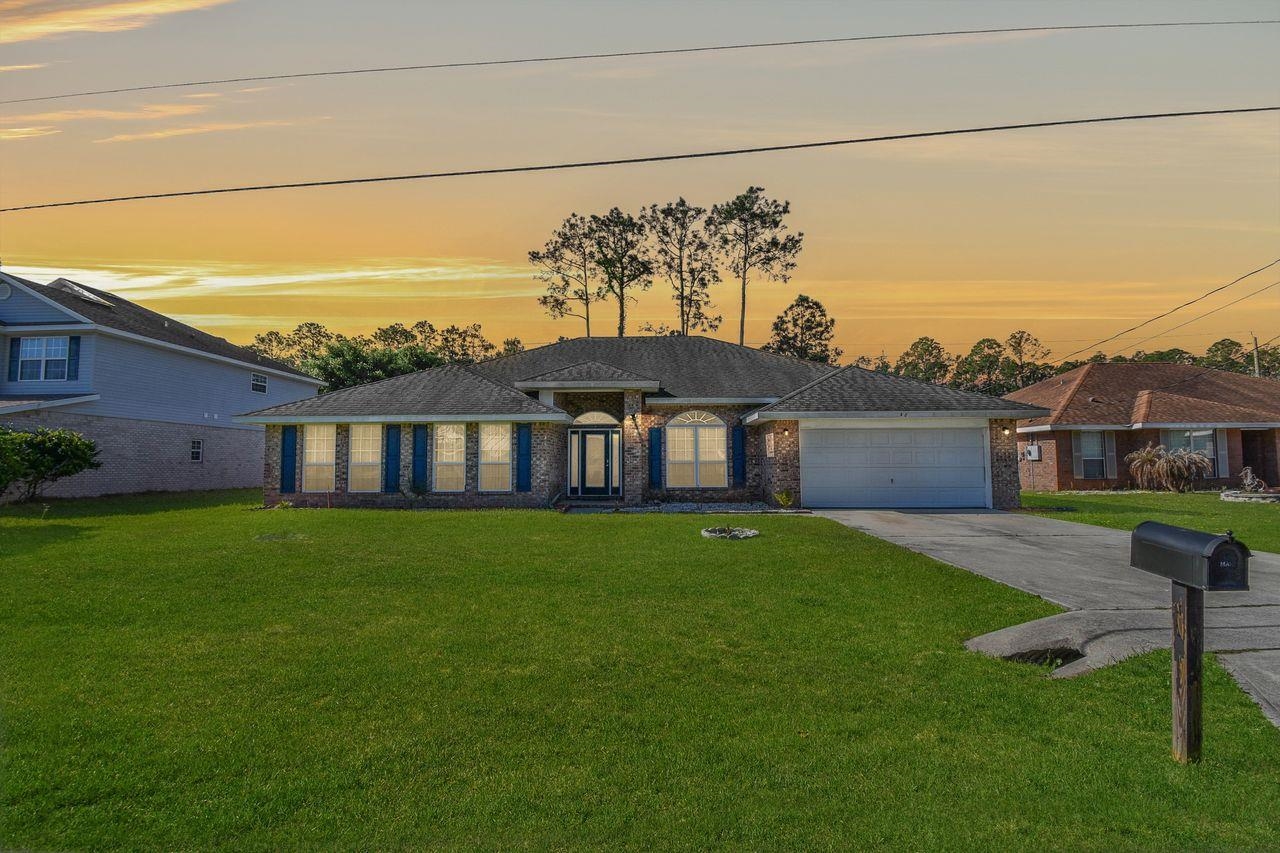 46 Riddle Drive Palm Coast, FL 32164 - Photo 2 of 20 a view of a yard in front of a house