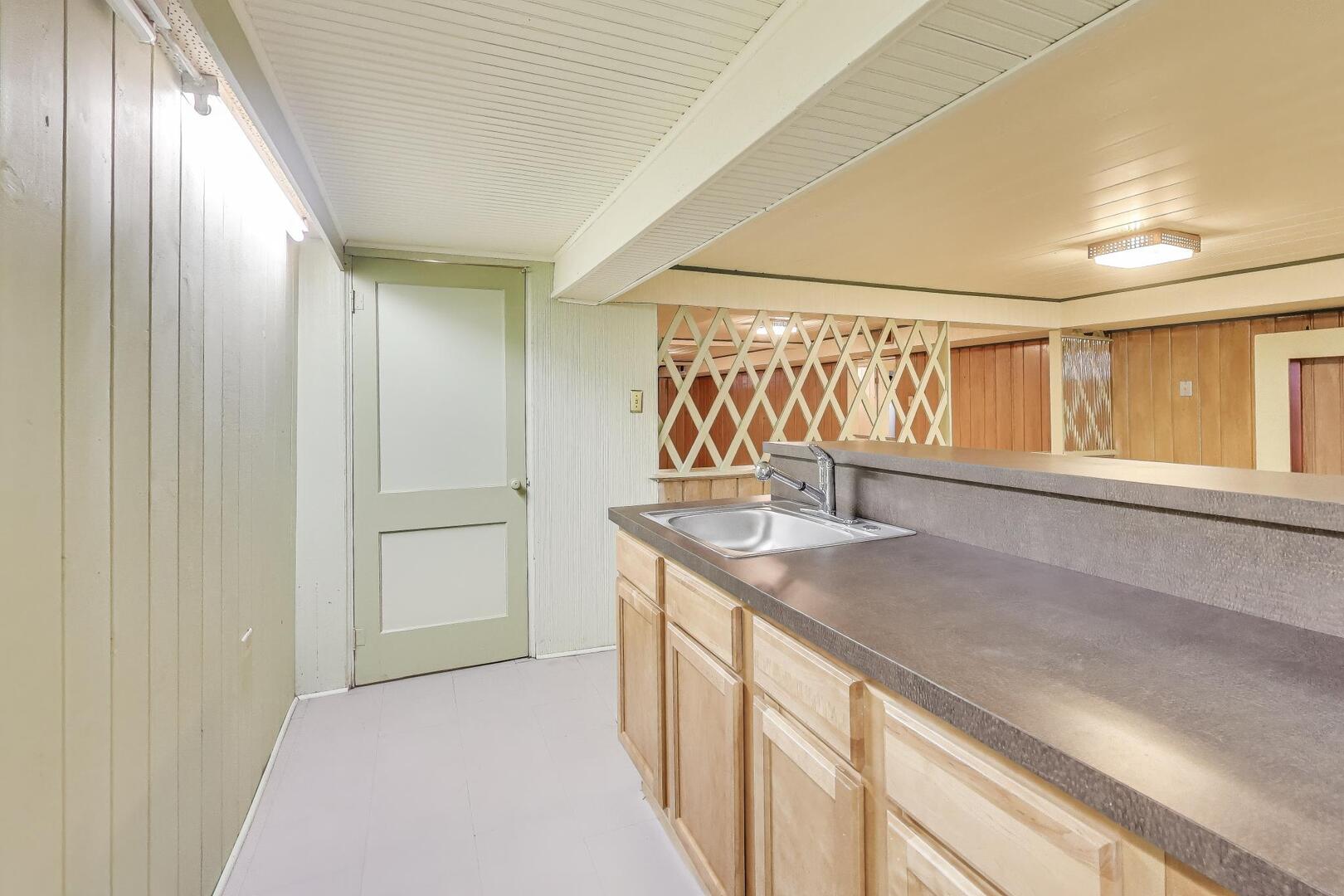 1115 North Ridgeland Avenue Oak Park, IL 60302 - Photo 25 of 40 a kitchen with a sink and a window