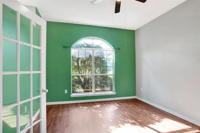 a view of a room that has a large window