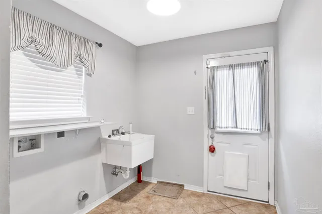 a kitchen with cabinets and stainless steel appliances