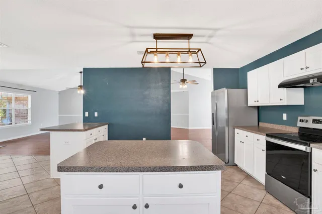a kitchen with a cabinets and window
