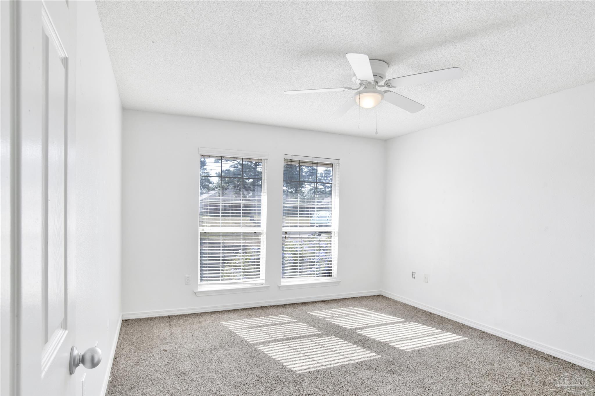 7604 Brewster Street Navarre, FL 32566 - Photo 29 of 36 a view of an empty room with a window