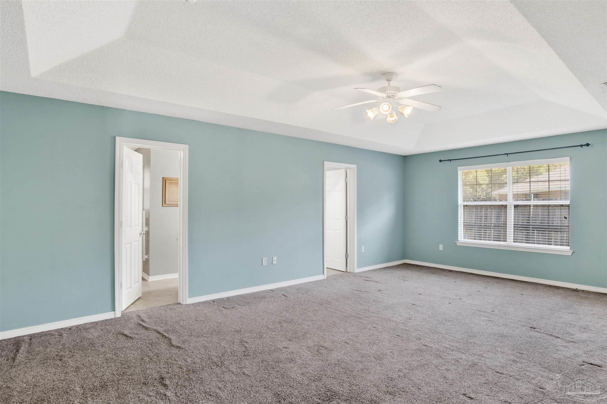 7604 Brewster Street Navarre, FL 32566 - Photo 32 of 36 a view of an empty room with a window