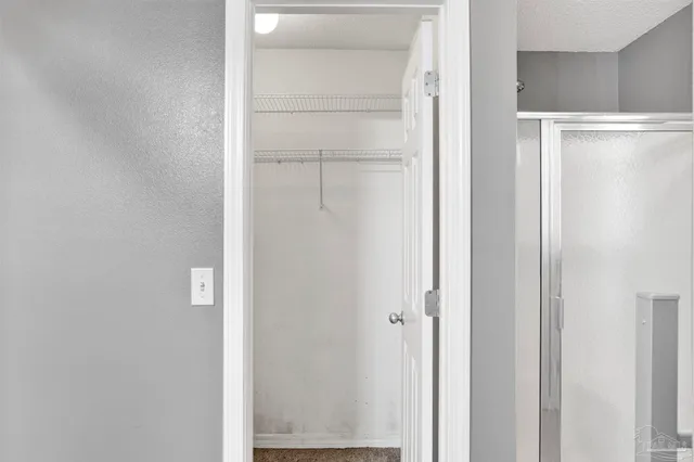 a bathroom with a bathtub and a window