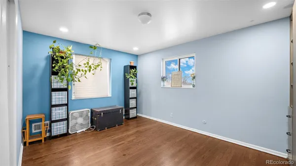 a view of room with window and wooden floor