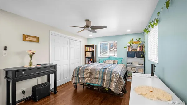 a bedroom with a bed and a table in it