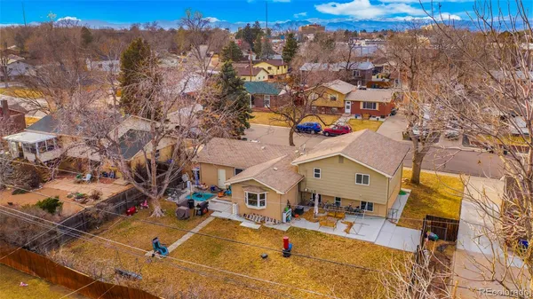 an aerial view of residential houses with outdoor space