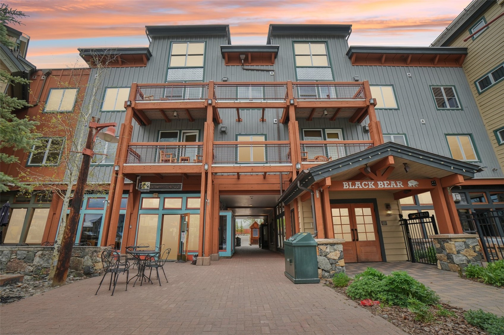 129 River Run Road, Unit 8055 Keystone, CO 80435 - Photo 48 of 50 Back of house at dusk with french doors, a balcony, and board and batten siding