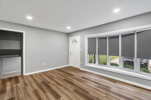 a view of an empty room with a window