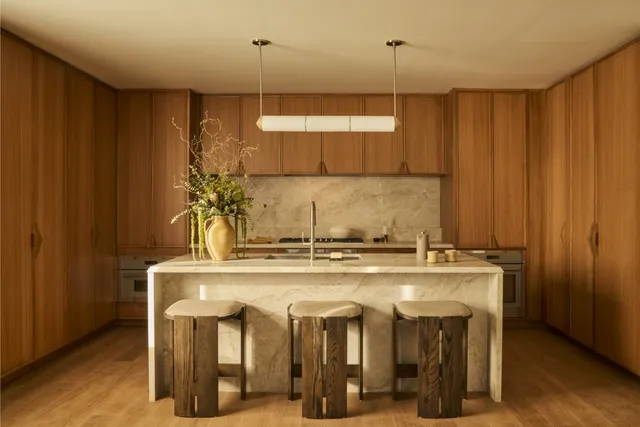 a kitchen with a stove and a refrigerator