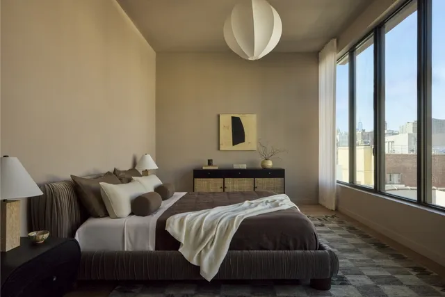 a bedroom with bed and window