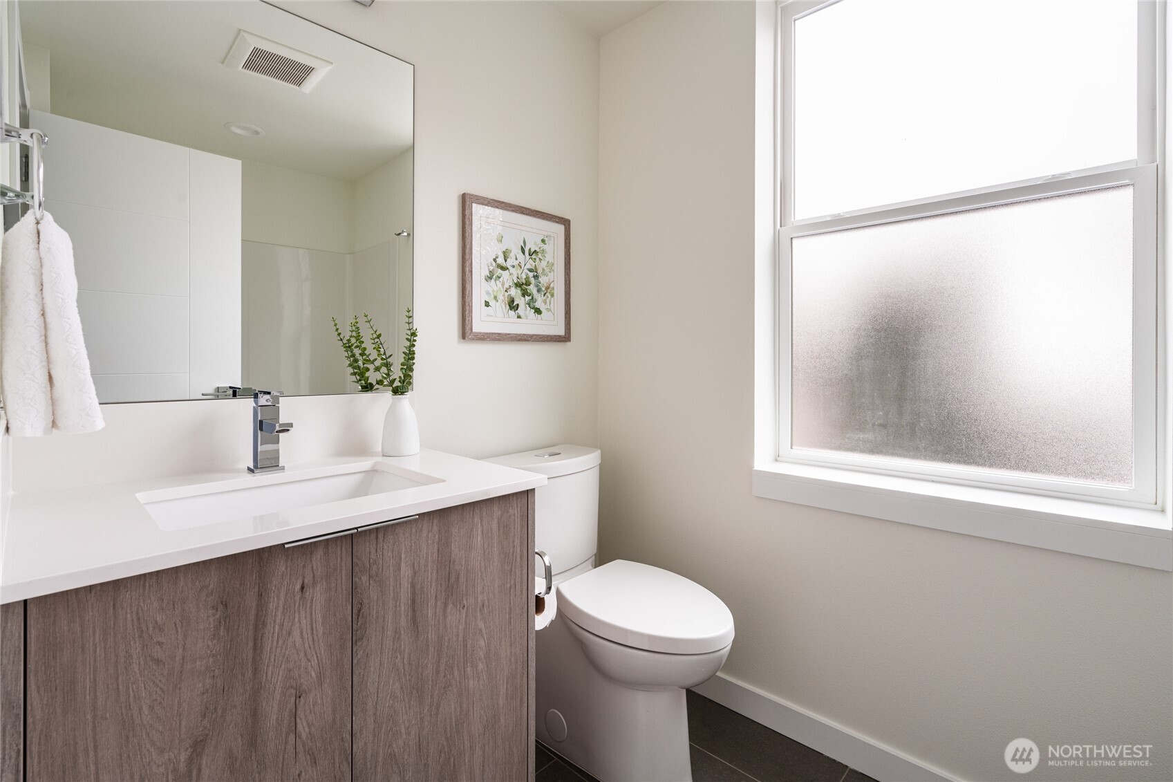 4155 Delridge Way Southwest Seattle, WA 98106 - Photo 11 of 22 a bathroom with a sink a toilet and a mirror