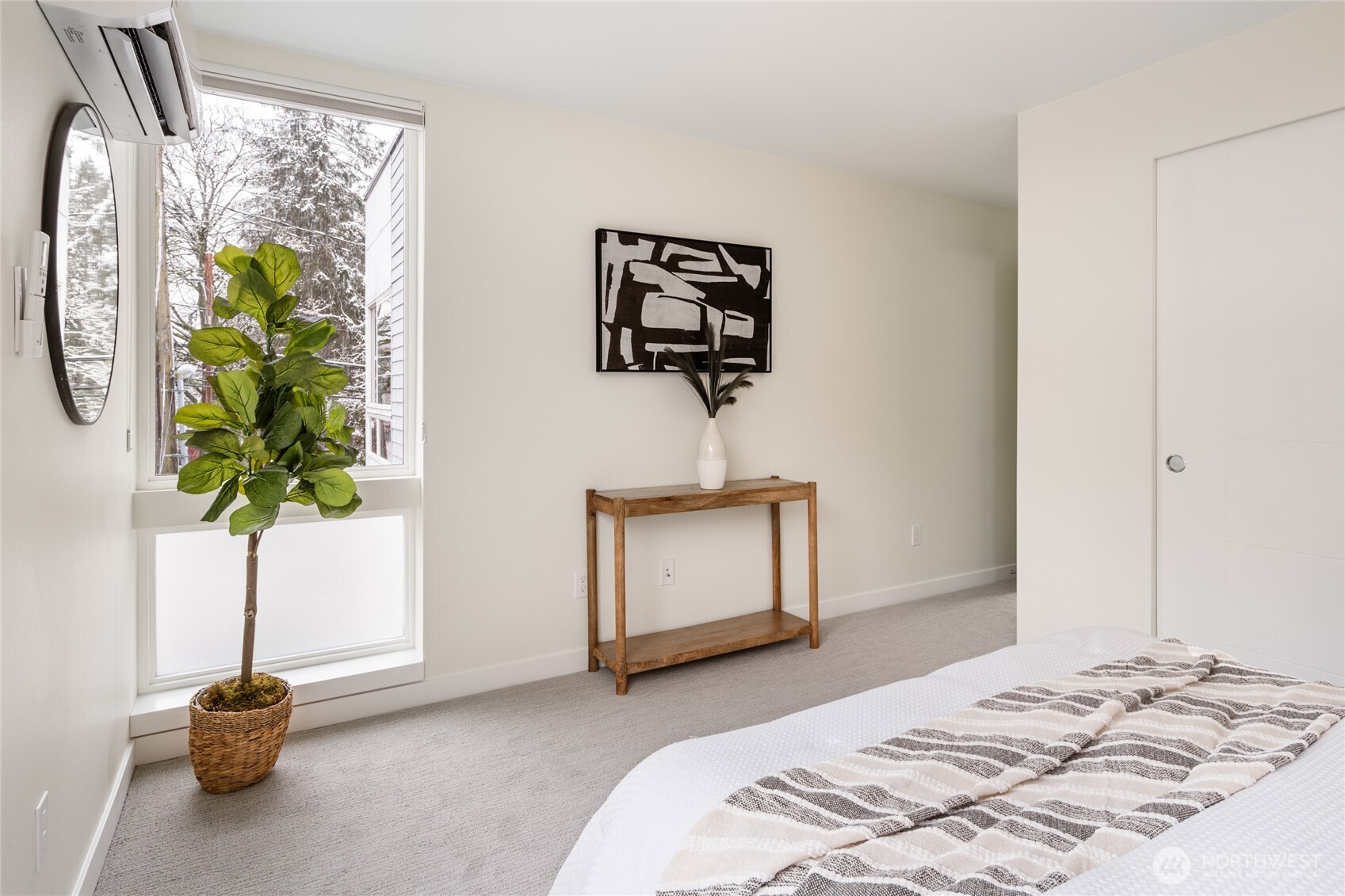 4155 Delridge Way Southwest Seattle, WA 98106 - Photo 14 of 22 a bedroom with a bed and a plant