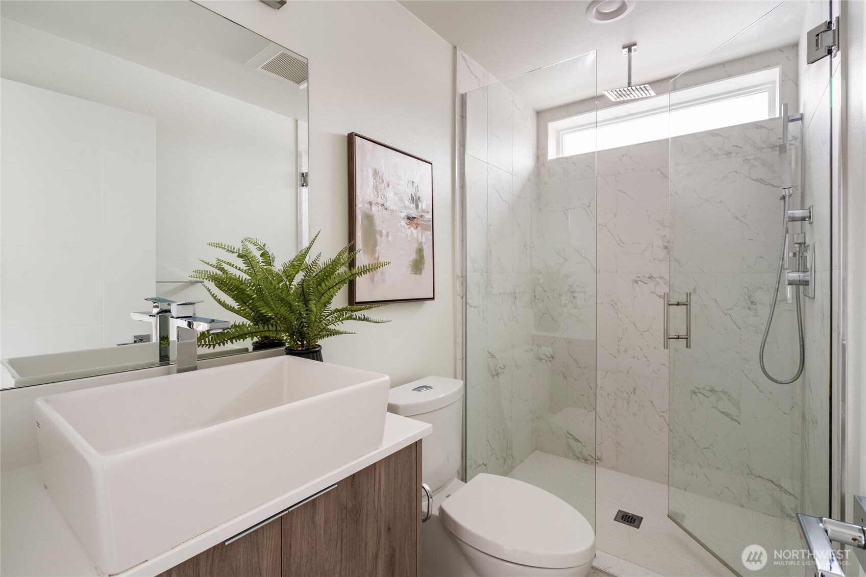 4155 Delridge Way Southwest Seattle, WA 98106 - Photo 15 of 22 a bathroom with a sink a toilet and shower