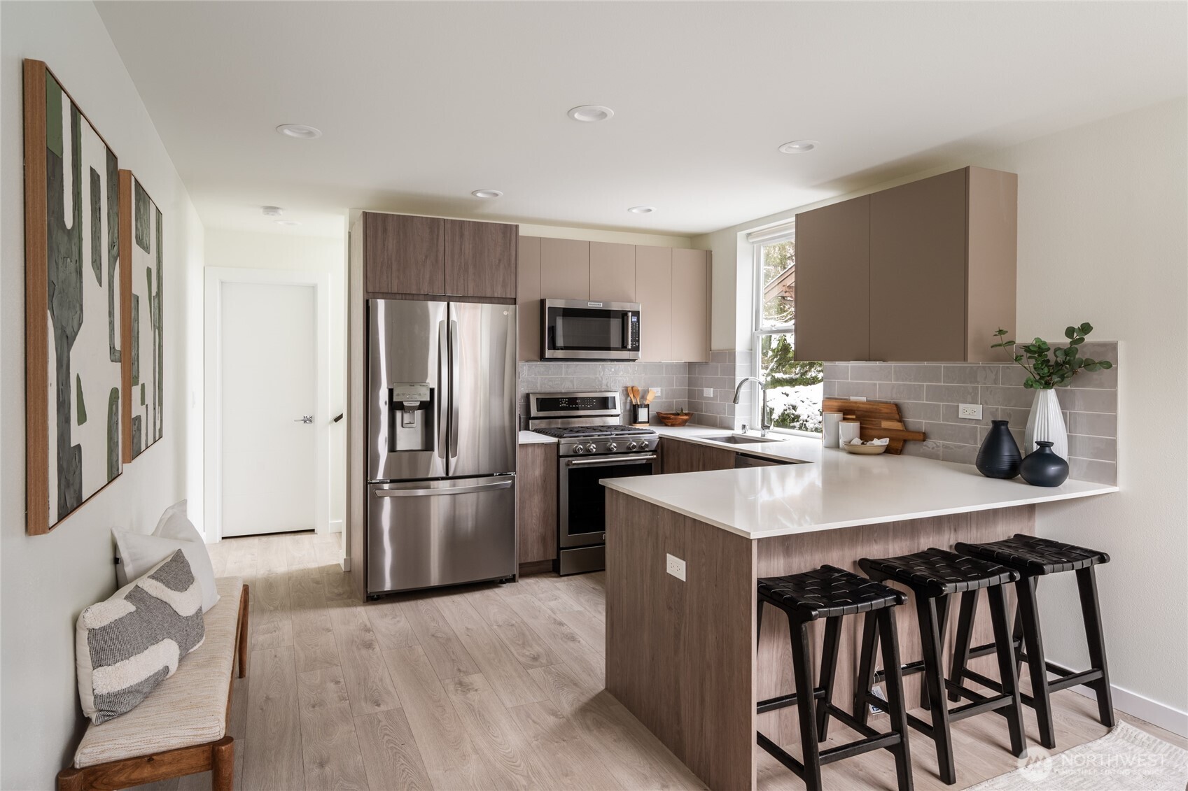 4155 Delridge Way Southwest Seattle, WA 98106 - Photo 2 of 22 a kitchen with a center island and stainless steel appliances