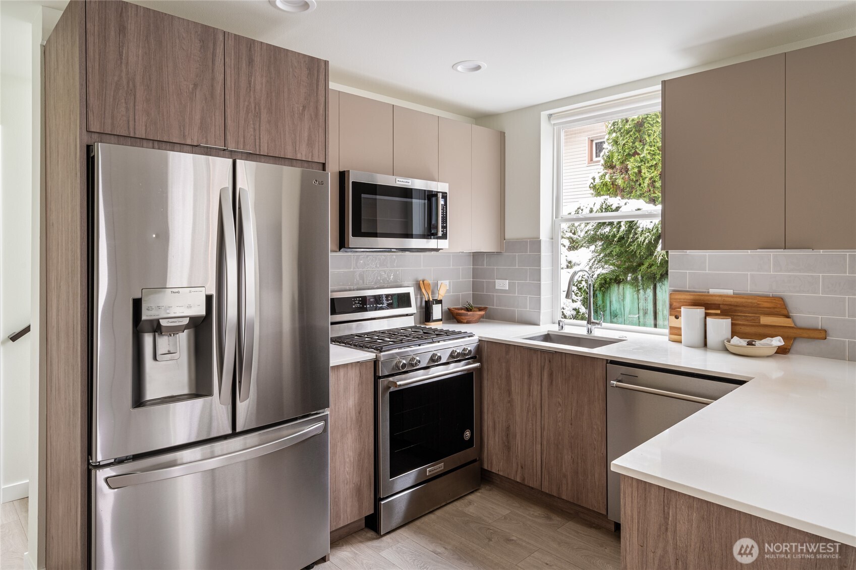 4155 Delridge Way Southwest Seattle, WA 98106 - Photo 4 of 22 a kitchen with a refrigerator sink and microwave