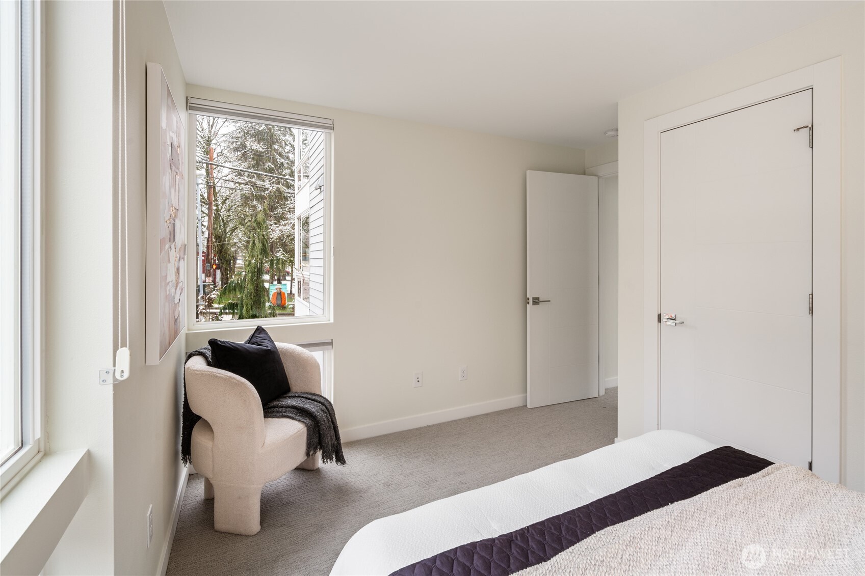 4155 Delridge Way Southwest Seattle, WA 98106 - Photo 9 of 22 a bedroom with a bed and a large window