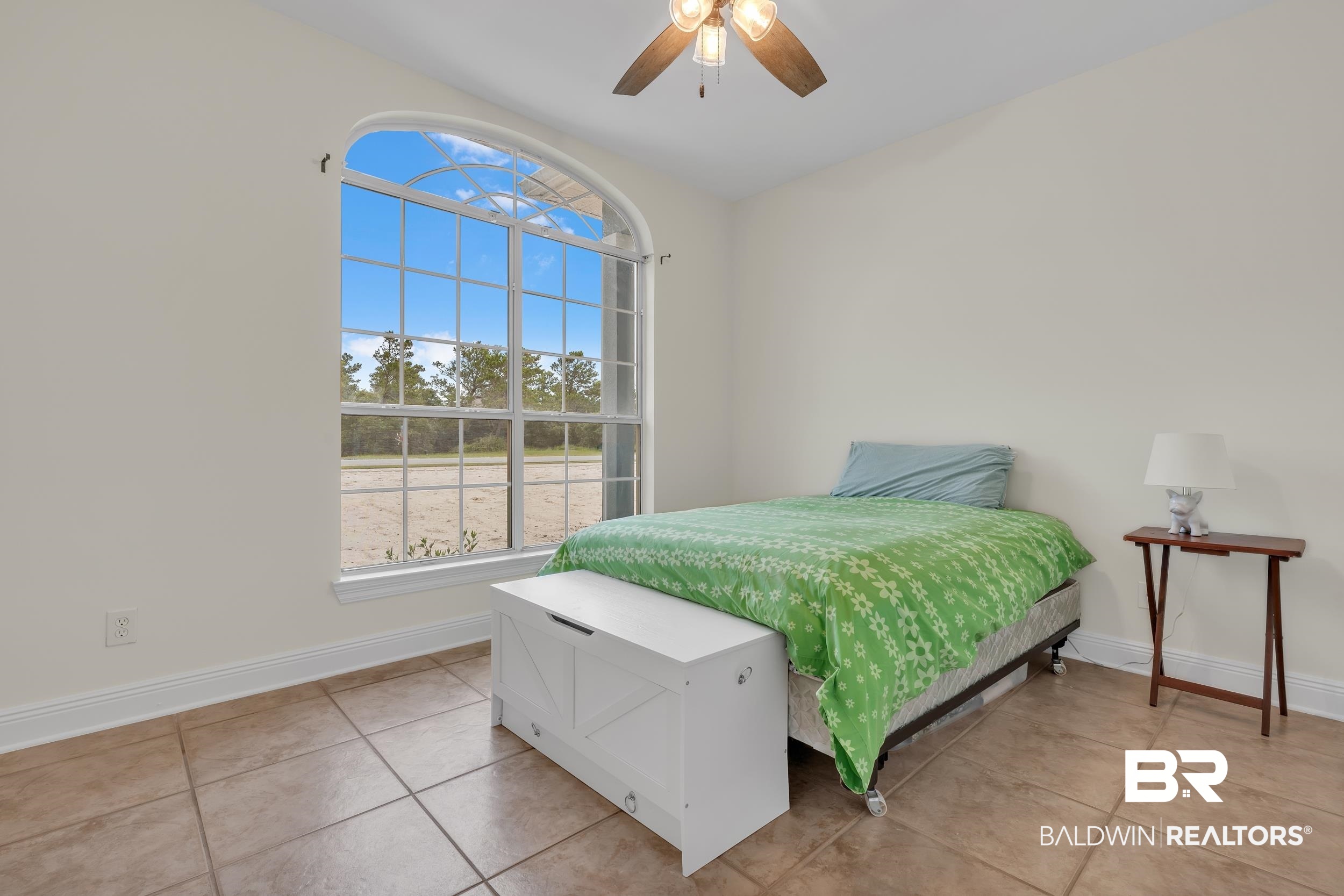 4606 Osprey Drive Orange Beach, AL 36561 - Photo 33 of 44 Bedroom featuring light tile patterned flooring and ceiling fan