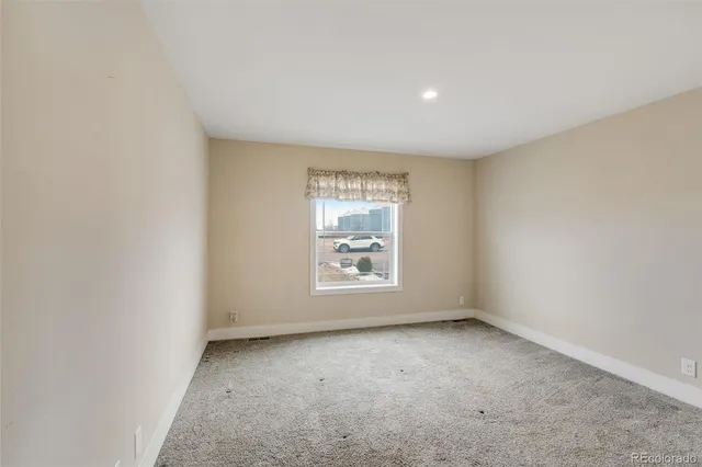a view of a hallway with washer and dryer
