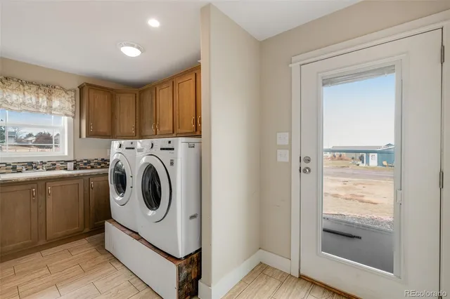 a bedroom with a bed couch and window