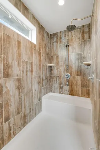 an aerial view of a house with a yard and big yard