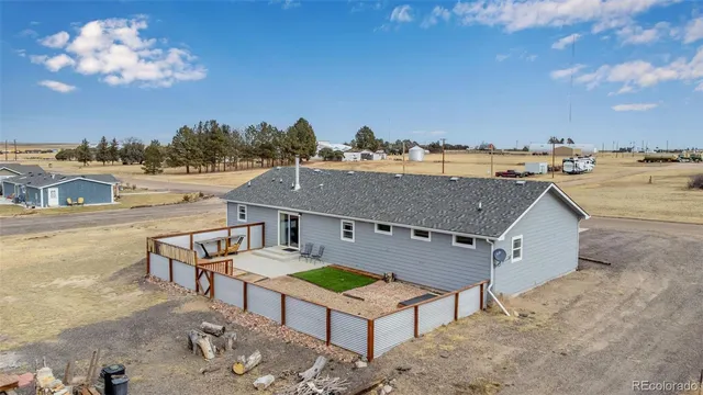 a view of a house with a balcony and a fireplace