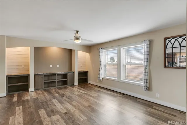a large kitchen with cabinets and stainless steel appliances