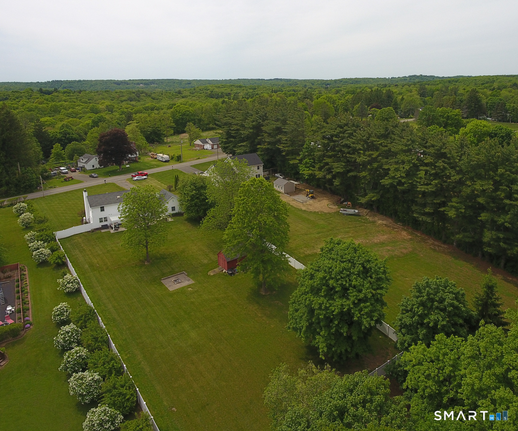 109 Harrison Lane Bethlehem, CT 06751 - Photo 27 of 28 a view of a lake with a houses