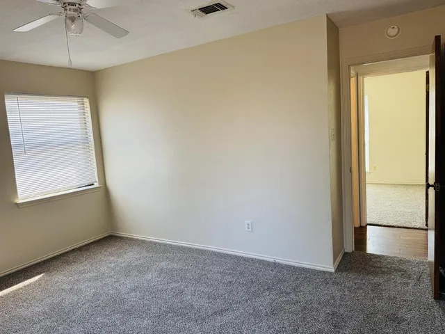 an empty room with a empty space and a window