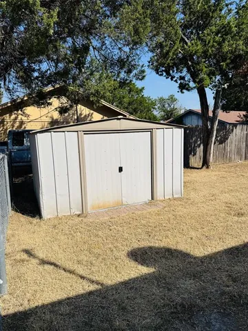 a house with trees in front of it