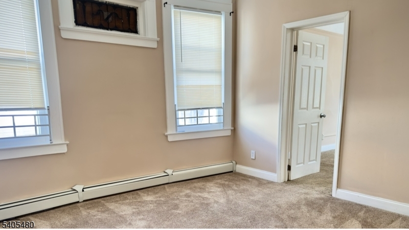 245 22nd Street Irvington, NJ 07111 - Photo 13 of 17 an empty room with windows