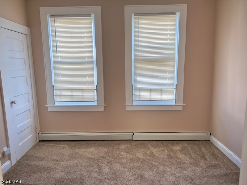 245 22nd Street Irvington, NJ 07111 - Photo 4 of 17 an empty room with a window