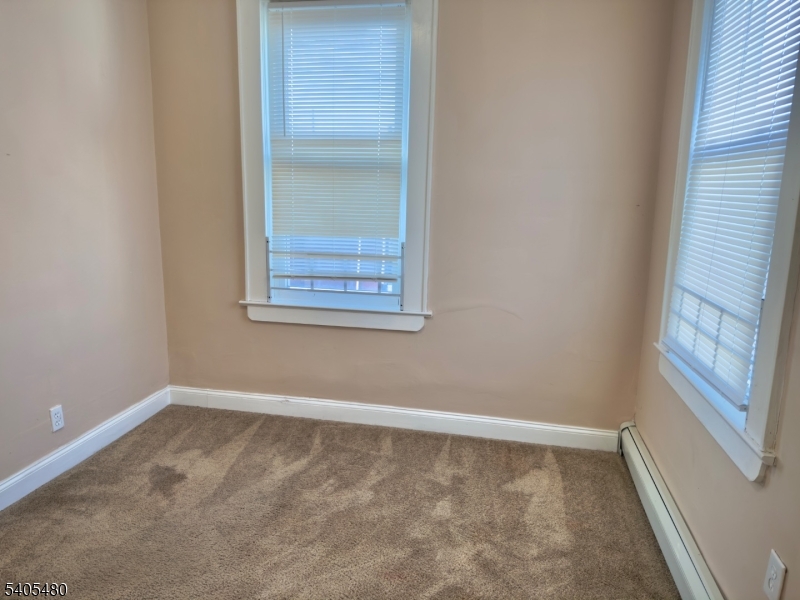 245 22nd Street Irvington, NJ 07111 - Photo 7 of 17 a view of an empty room with a window