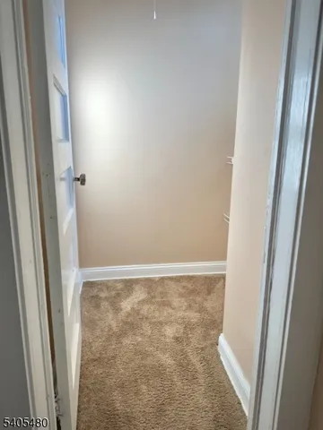 a view of small space with racks on the wall