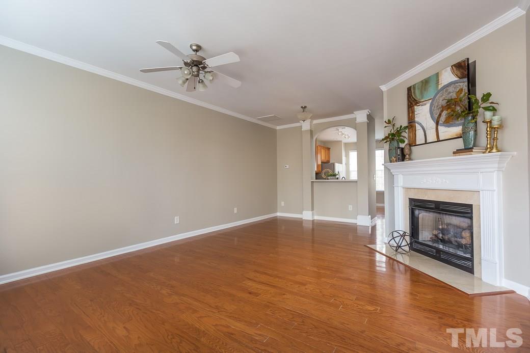 7739 Winners Edge Street Raleigh, NC 27617 - Photo 11 of 12 a view of a livingroom with a fireplace and window