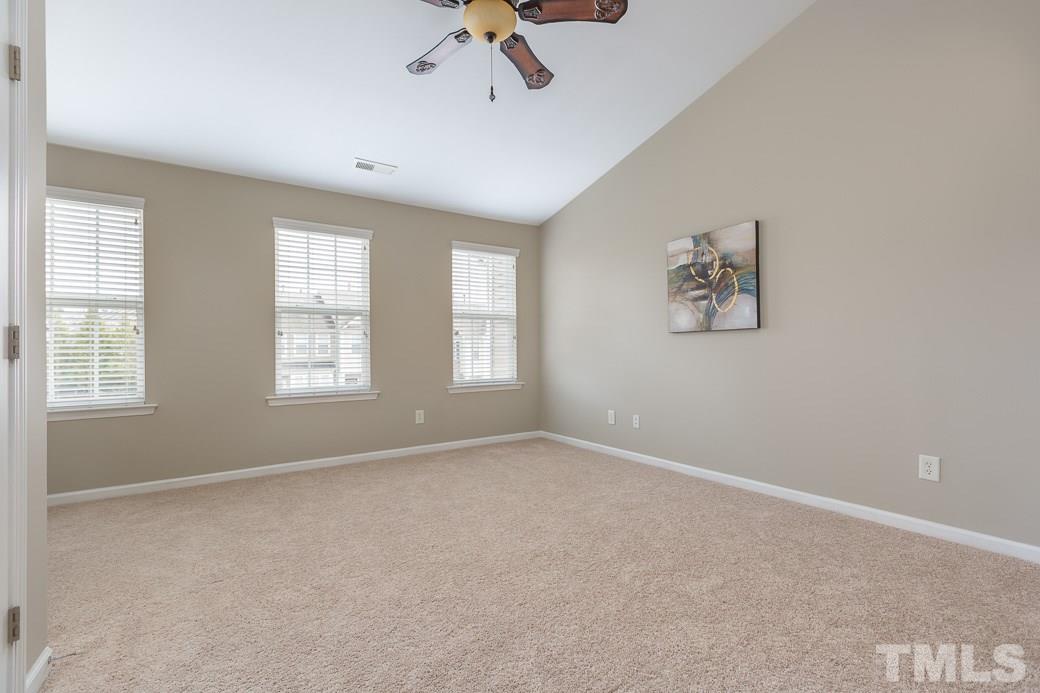 7739 Winners Edge Street Raleigh, NC 27617 - Photo 5 of 12 a view of an empty room with a window