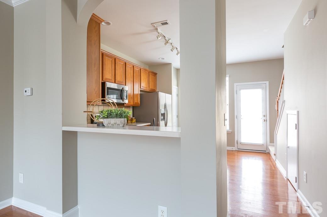 7739 Winners Edge Street Raleigh, NC 27617 - Photo 12 of 12 a view of a kitchen from the hallway