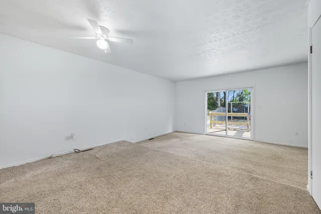 a kitchen with granite countertop a refrigerator and a sink